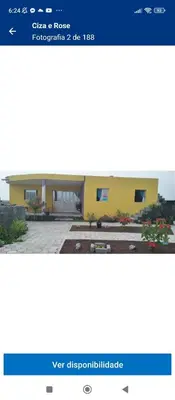 a screenshot of a website of a yellow building at Ciza e Rose in Portela