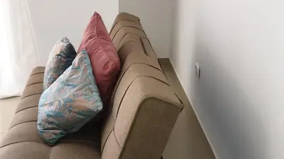 two pillows on a couch in a room at Appartement de Revé in Praia