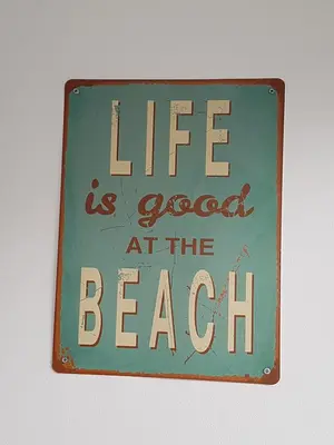 a sign that reads life is good at the beach at Casa Io - Goraz in Mindelo