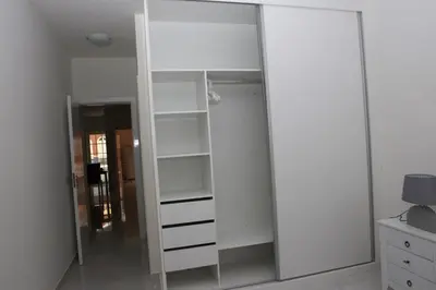 a large mirror in a room with a closet at Apartamento Micael in Praia