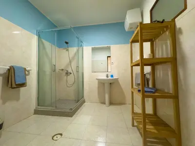 a bathroom with a shower and a sink at Misturod - Holiday Apartments in Santa Maria