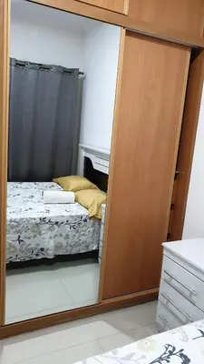 a bedroom with a door leading to a bed at Jessica Appartment in Praia