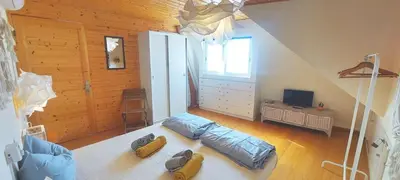 a bedroom with a large bed in a attic at Beach penthouse with rooftopbar and Fiber WiFi, spectacular 180 degrees ocean view in Santa Maria