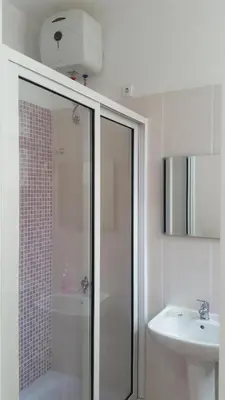 a bathroom with a shower and a sink at ka-Bela in Sal Rei
