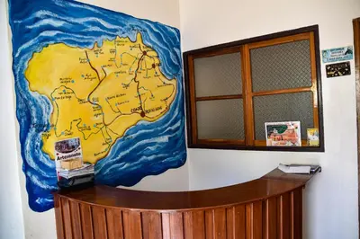a map on a wall next to a window at Residencial Vitoria in Ponta do Sol