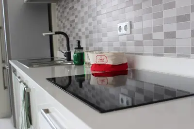 a kitchen counter with a sink and a bag on it at Kasa Imbondeiro in Mindelo