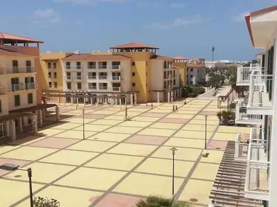 a view of a courtyard with street lights and buildings at Apartment in Vila Verde - Pool view - Santa Maria in Santa Maria
