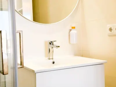 a bathroom with a sink and a mirror at BIA D'Olaf Apartments in Santa Maria