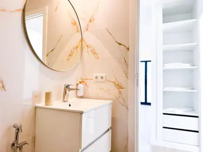 a bathroom with a sink and a mirror at BIA D'Olaf Apartments in Santa Maria