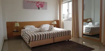a bedroom with two beds with teddy bears on them at Apartamentos DECOR in Tarrafal