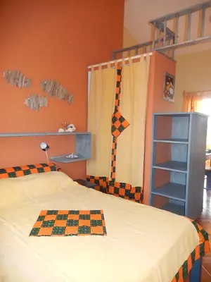 a bedroom with a bunk bed with a checkered blanket at Residenz Stella Maris Apartment Strela in Vila do Maio