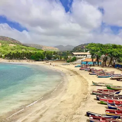 a beach with many boats sitting on the sand at Casa Sodadi in Praia