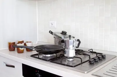 a pot sitting on top of a stove in a kitchen at Special Price long term in Sal Rei