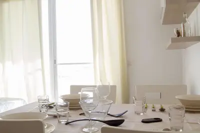 a table with wine glasses on it with a window at Special Price long term in Sal Rei