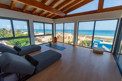 a living room with a couch and a view of the ocean at Angulo House in Santa Maria