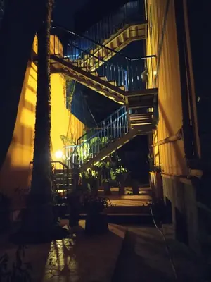 a staircase leading up to a building at night at Charming 2BR with Refreshing Ocean View in Praia