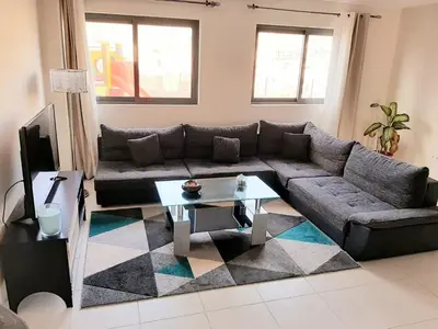 a living room with a couch and a coffee table at Apartment with pool in Mindelo in Mindelo