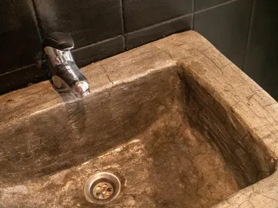 a sink with a water faucet in a bathroom at Casa Blu Guesthouse - Casa de Hospedes in Santa Maria