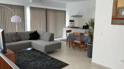 a living room with a couch and a table at Paradise Cape Verde in Santa Maria