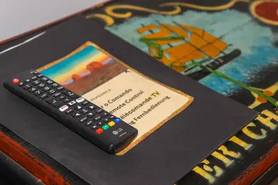 a remote control sitting on top of a table at Mister Barracuda in Santa Maria