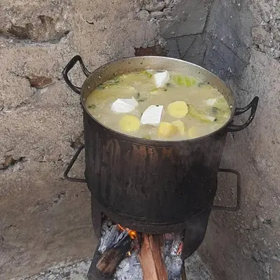 a pot of soup sitting on top of a stove at Casa Pedrina in Ribeira Grande