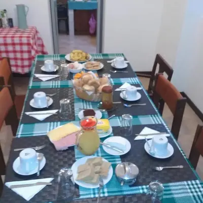 a table with plates of food on top of it at Casa Pedrina in Ribeira Grande
