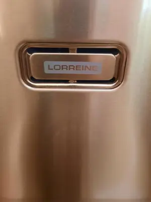 a metal door with the words lorene on it at Porto Antigo 2 Beach Club in Santa Maria