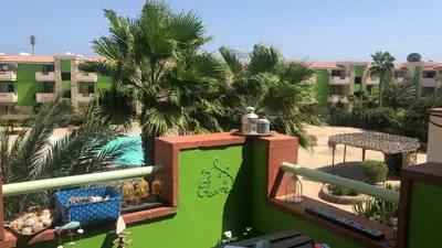 a view of a pool from a balcony of a resort at More then a beautiful apart The real Morabeza Capeverdean hospitality in Santa Maria