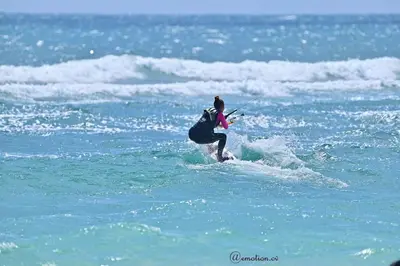 a person on a surfboard in the ocean at More then a beautiful apart The real Morabeza Capeverdean hospitality in Santa Maria