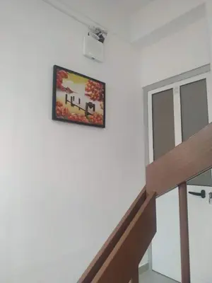 a picture hanging on a wall next to a staircase at Plateau Bedroom & Chambre - Praia Center 1 in Praia