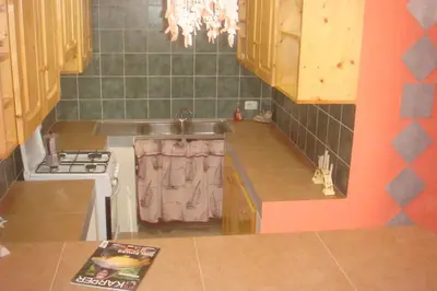 a kitchen with a sink and a stove at Kasa Mona in Calheta Do Maio