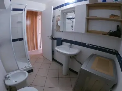 a bathroom with a sink and a toilet and a shower at Leme Bedje fronte spiaggia in Santa Maria
