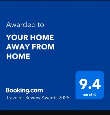 a blue phone screen with the text emailed to your home away from home at YOUR HOME AWAY FROM HOME in Praia