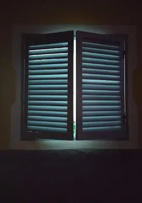 two windows with blinds in a dark room at Ca' Santa Barbara, Free Wi-fi, Sea view, Sal Rei, Boa Vista, Cape Verde in Sal Rei