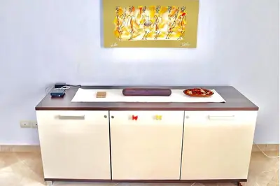 a counter with a plate of food on top of it at Comfortable and spacious apartment with ocean views of Cabral beach in Sal Rei