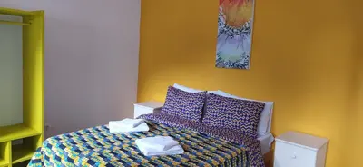 a bedroom with a bed with towels on it at THE RETREAT in Monte Joana