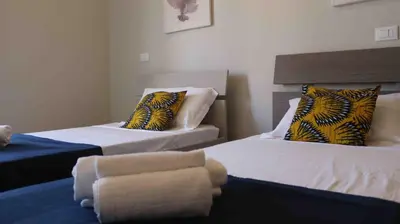 a room with two beds with towels on them at KatlantiK Ca Madeira Deluxe in Sal Rei