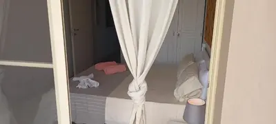 a room with a bed with a curtain at KatlantiK Ca Madeira Deluxe in Sal Rei