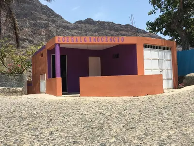 a building with a sign on it in the desert at Casa Familiar Gilda in Ribeira Grande