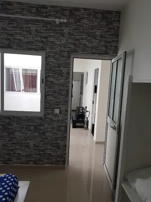 a room with a brick wall and a hallway at Bellamy in Porto Novo