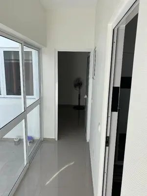 an empty room with a hallway with a window at Bellamy in Porto Novo