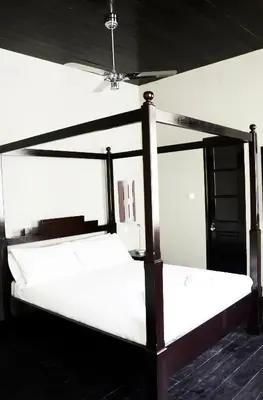 two bunk beds in a room with a ceiling at Casa Colonial in Mindelo