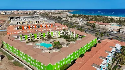 an aerial view of a resort with a beach at Djadsal Moradias - by Bobbywashere in Santa Maria