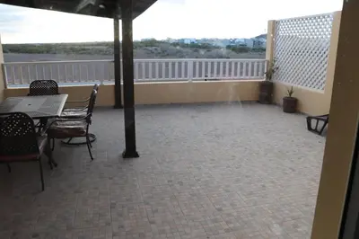 a room with a balcony with a table and chairs at LAFAYETTE Alojamentos in Espargos