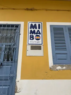 a sign on the side of a building with a door at B&B Mi Ma Bo, Sal Rei, Boa Vista, Cape Verde, FREE WI-FI in Sal Rei