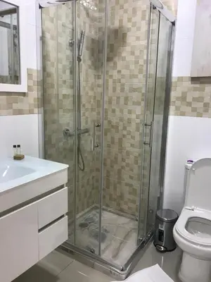 a bathroom with a shower and a toilet at Txon DFogo Pensão Restaurante in São Filipe