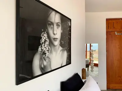 a large picture of a woman on a wall at Palmeira Da Cruz EcoLodge in Chã da Igreja