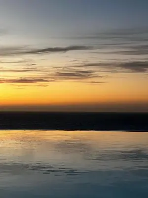 a view of the ocean at sunset at Palmeira Da Cruz EcoLodge in Chã da Igreja