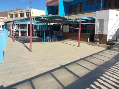 a parking lot with a building under construction at Residencial Laginha in Mindelo
