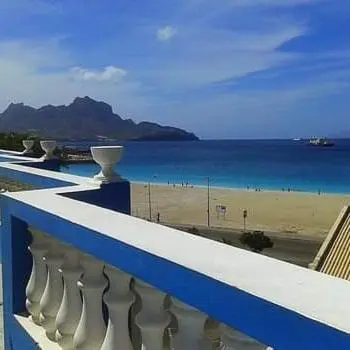 a blue and white balcony with a view of a beach at Residencial Laginha in Mindelo